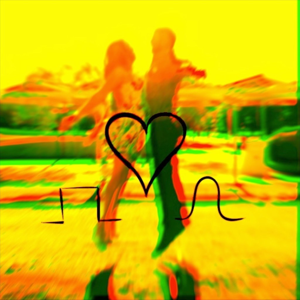 Una pareja bailando en un ambiente alegre con un fondo colorido y un símbolo de amor en el centro de la imagen.